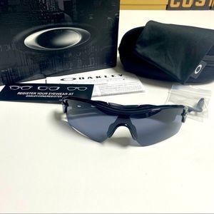 Authentic and Genuine Oakley Radar, New In Box 09-670. Polished black with grey